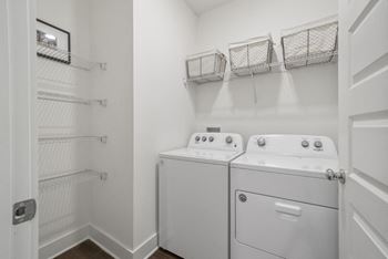 Laundry room with full-size side-by-side
